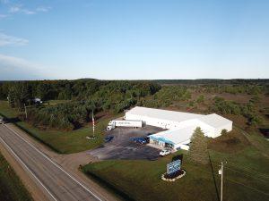 Modern Kiss Carpet Design Center in Mancelona, Michigan – today's expanded showroom and warehouse serving Northern Michigan